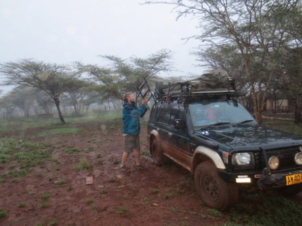 Packing up in the rain at Henry's camp
